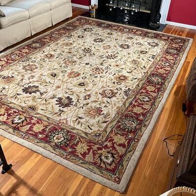 FLORAL AREA RUG | Floral design over tan field with red flower bud border; 10 ft. 10 in. x 7 ft. 10 in.