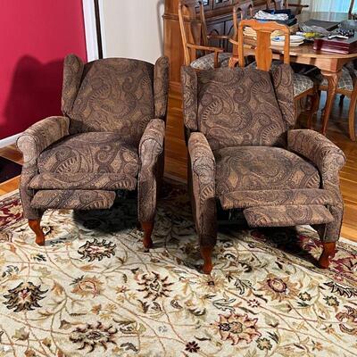 PAIR RECLINING ARMCHAIRS | Wingback reclining armchairs having textured paisley upholstery, fronted by two short cabriole legs, with...