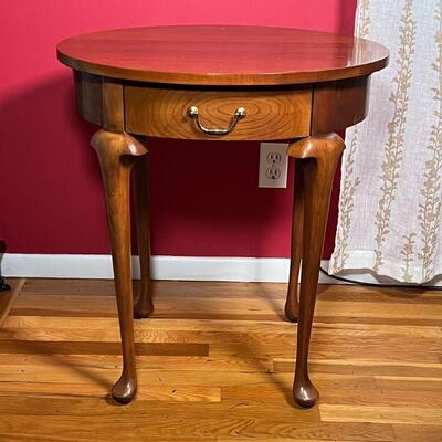 OVAL SIDE TABLE | With single drawer and two pull out drink rests on either side all over four cabriole legs; 26 x 22 in.