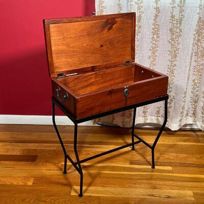 SIDE TABLE / MINI CHEST | A small chest with a hinged lid sitting atop a metal wire frame, can be used as a side table with storage; h....