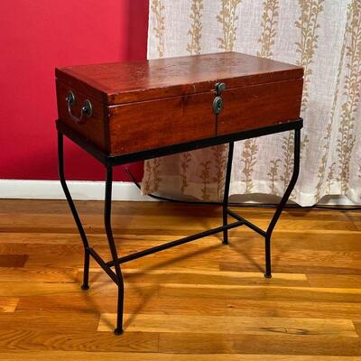 SIDE TABLE / MINI CHEST | A small chest with a hinged lid sitting atop a metal wire frame, can be used as a side table with storage; h....