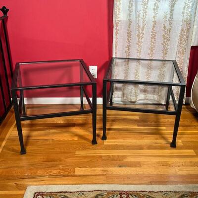 (2pc) IRON SIDE TABLES | Pair of iron frame side tables with two tiers of glass surfaces; can be put together to form a larger coffee...