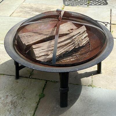 OUTDOOR FIRE PIT | Metal four legged round fire pit with cover and tongs, naturally rusted; dia. 30 x h. 20 in.