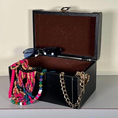 LEATHER BOX of COSTUME JEWELRY | Mostly pooka shells, etc, and a pair of sunglasses, in a black hinged lid box