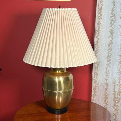 BRASS TABLE LAMP | With a pleated lamp shade; base dia. 7 x h. 27 in.