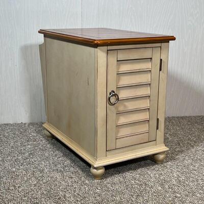SIDE TABLE CABINET | End table with a cabinet door and a magazine holder on the opposite end; h. 23-1/4 x w. 16 x d. 28-1/2 in.