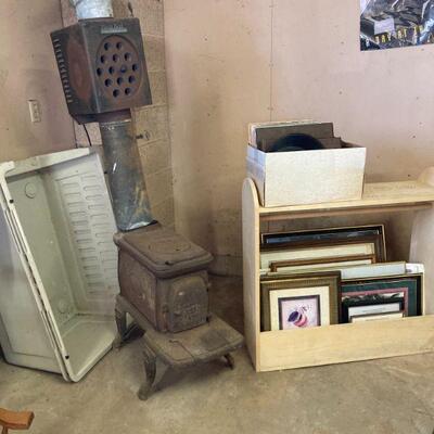 Stove, large dog kennel and pictures