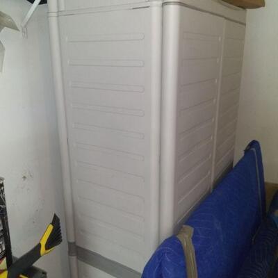 Two white garage plastic cabinets $50.00 each