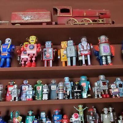 Shelves of robots. many with original boxes 