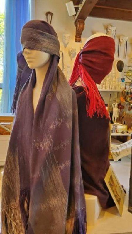 By Gayle White. Three foam mannequins draped in hand woven, hand dyed shawls