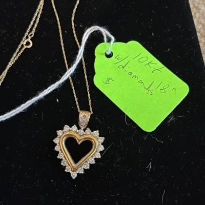 14kt gold heart necklace w/diamonds  not left overnight on property 