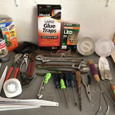 Tools, shelving, pest control. Crescent Wrenches,
pliers, gardening tools, saw, flood lights, etc.