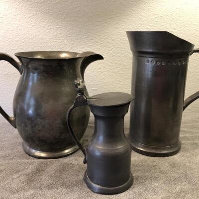 (3) Antique pewter pitchers.