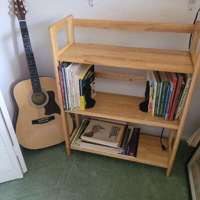guitar and a shelf unit