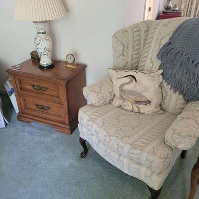 another wingback chair and an end table or night stand