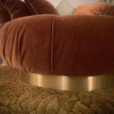 Sofa and chairs have brass bases