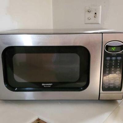 #2454 â€¢ Kitchenaid Toaster, Sharp Carousel Microwave, and Black & Decker Coffee Maker Microwave Serial Number: 25710 Microwave Model...