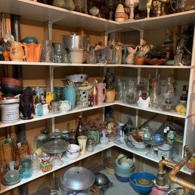 Large variety of antique and collectible glass lamps glassware etc.