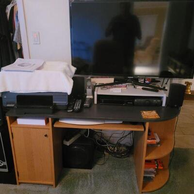computer desk and a Samsung 46