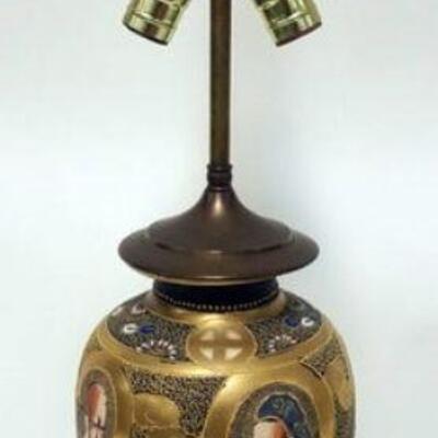 1064	DELFT TABLE LAMP, SMALL CHIP ON BASE FOOT. APPROXIMATELY 23 IN HIGH
