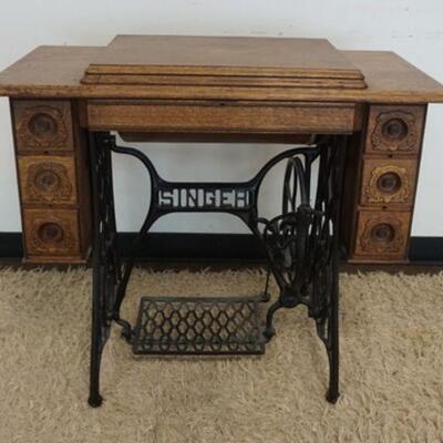 1160	OAK SINGER TREADLE SEWING MACHINE IN ORNATE CASE W/FANCY CAST IRON BASE, APPROXIMATELY 37 IN X 18 IN X 30 IN HIGH
