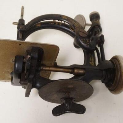 1259	WILCOX & GIBBS SEWING MACHINE, LAST PATENT DATE 1883, 10 1/2 IN WIDE , HAS BOLT TO ATTACH TO TABLE & ORIGINAL LITHO
