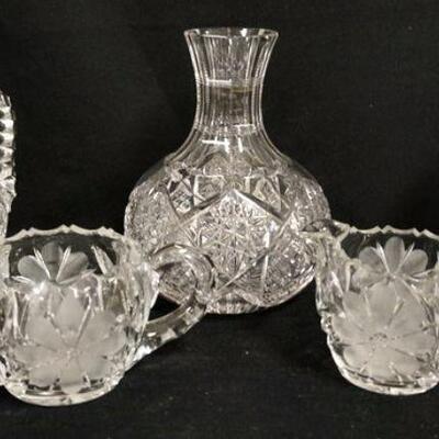 1201	5 PIECE CUT GLASS LOT, CREAMER HAS A RIM CHIP, CRUET HAS ORIGINAL STOPPER, WATER BOTTLE IS 8 IN HIGH
