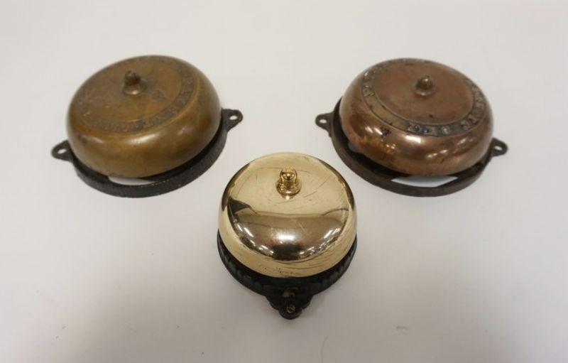 1011	LOT OF 3 ANTIQUE CAST IRON & BRASS DOOR BELLS, MECHANICAL, EARLIEST PATENT DATE 1860, LARGEST APPROXIMATETLY 6 IN X 2 1/4 IN HIGH

