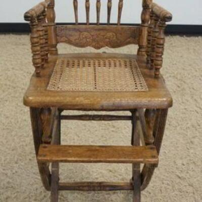 1158	ANTIQUE OAK PRESSED BACK CHILDS HIGH CHAIR, ADJUSTABLE, APPROXIMATELY 43 IN HIGH
