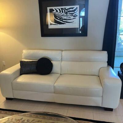 matching white leather sofas