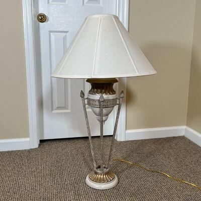 ITALIANATE TABLE LAMP | Designed as a small urn resting on four torch-form rods on a gilt base; overall h. 36 in.