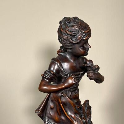 AUGUSTE MOREAU BRONZE SCULPTURE | Auguste Moreau signed bronze sculpture/statue of young girl holding a bird; h. 17-1/2 in.