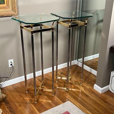 PAIR GLASS SIDE TABLES | Beveled glass side tables / pedestals, having octagonal tops over gold and chrome frames; each h. 41-3/4 x 18 x...