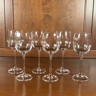 (6pc) WINE GLASSES | Six stemmed white wine glasses with a subtle ripple design to the bowls; h. 8-14 in.