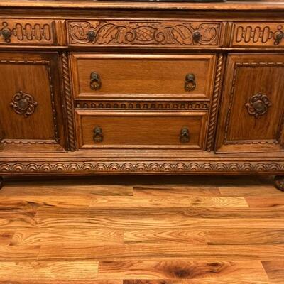 Solid hand carved wood buffet with drawers, and shelving. Circa Early 1900s very good condition. $150