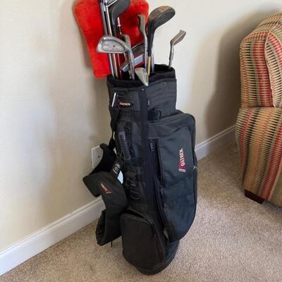 Variety of golf clubs and bag $25