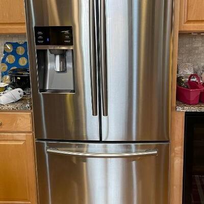 Samsung French door refrigerator stainless steel with freezer in the bottom.