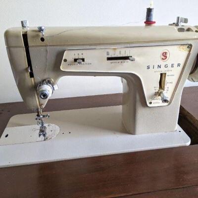 Vintage Singer 237 model sewing machine in desk