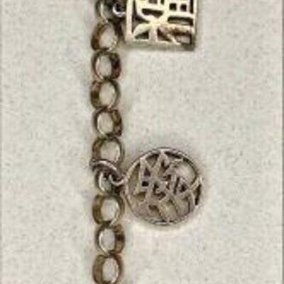 https://www.ebay.com/itm/125335738775	NC614 STERLING SILVER LENOX BRACELET WITH ASIAN KANJI CHARMS TOGGLE CLASP 		Auction	begins...