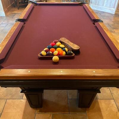 Brunswick Balk Collender Pool Table in very good condition and recently was re-felted! Includes the pool cues pictured with the table....