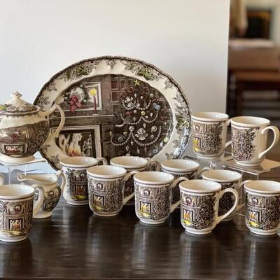 Johnson Brothers Christmas Friendly Village Platter, Teapot, Creamer and 12 Mugs. All items are in good condition with no noted chips or...