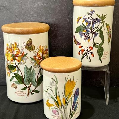 Three Piece Portmeirion Botanic Gardens Canister Set. In very good condition with light wear to the wooden lids and measuring 8.5",...