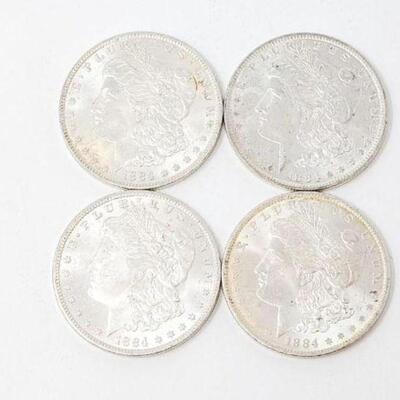 #1292 â€¢ (4) 1884 Morgan Silver Dollars, 107g.Weighs Approx: 107g New Orleans Mints. 