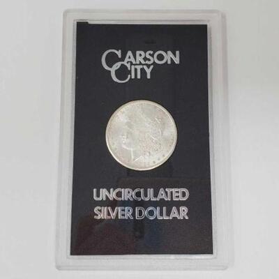 #1215 â€¢ 1878 Morgan Silver Dollar. Carson City Mint Uncirculated Morgan Silver Dollar.