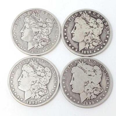 #1291 â€¢ (4) Morgan Silver Dollars, 104.3g. Weighs Approx: 104.3g (3) 1892 New Orleans Mints and (1) 1899 New Orleans Mint./ 
