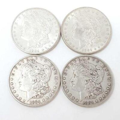 #1297 â€¢ (4) 1884 Morgan Silver Dollars, 106.6g. Weighs Approx: 106.6g Philadelphia Mints.