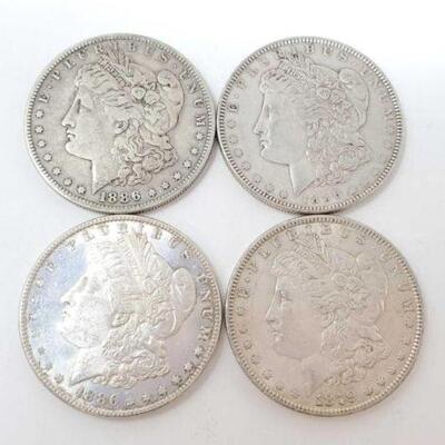 #1255 â€¢ (4) Morgan Silver Dollars, 106.7g. Weighs Approx: 106.7g (2) 1886 Philadelphia Mints, (1) 1879 Philadelphia Mint, and (1) 1886...