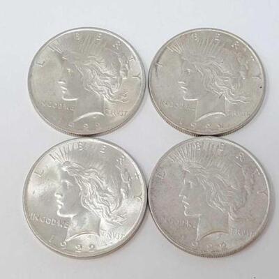 #1545 â€¢ (4) 1922 Silver Peace Dollars, 107.2g. Weighs Approx: 107.2g Philadelphia Mints.