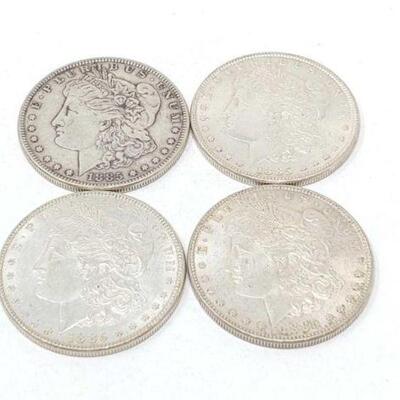 #1339 â€¢ (4) 1885 Morgan Silver Dollars, 107g. Weighs Approx: 107g Philadelphia Mints. 
