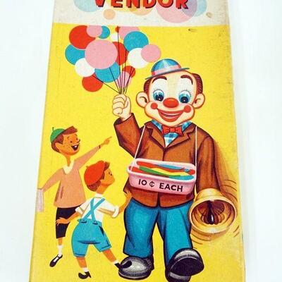 1266	VINTAGE BATTERY OPERATED TOY BALLOON VENDOR, 1961 JAPAN, APPROXIMATELY 11 IN HIGH
